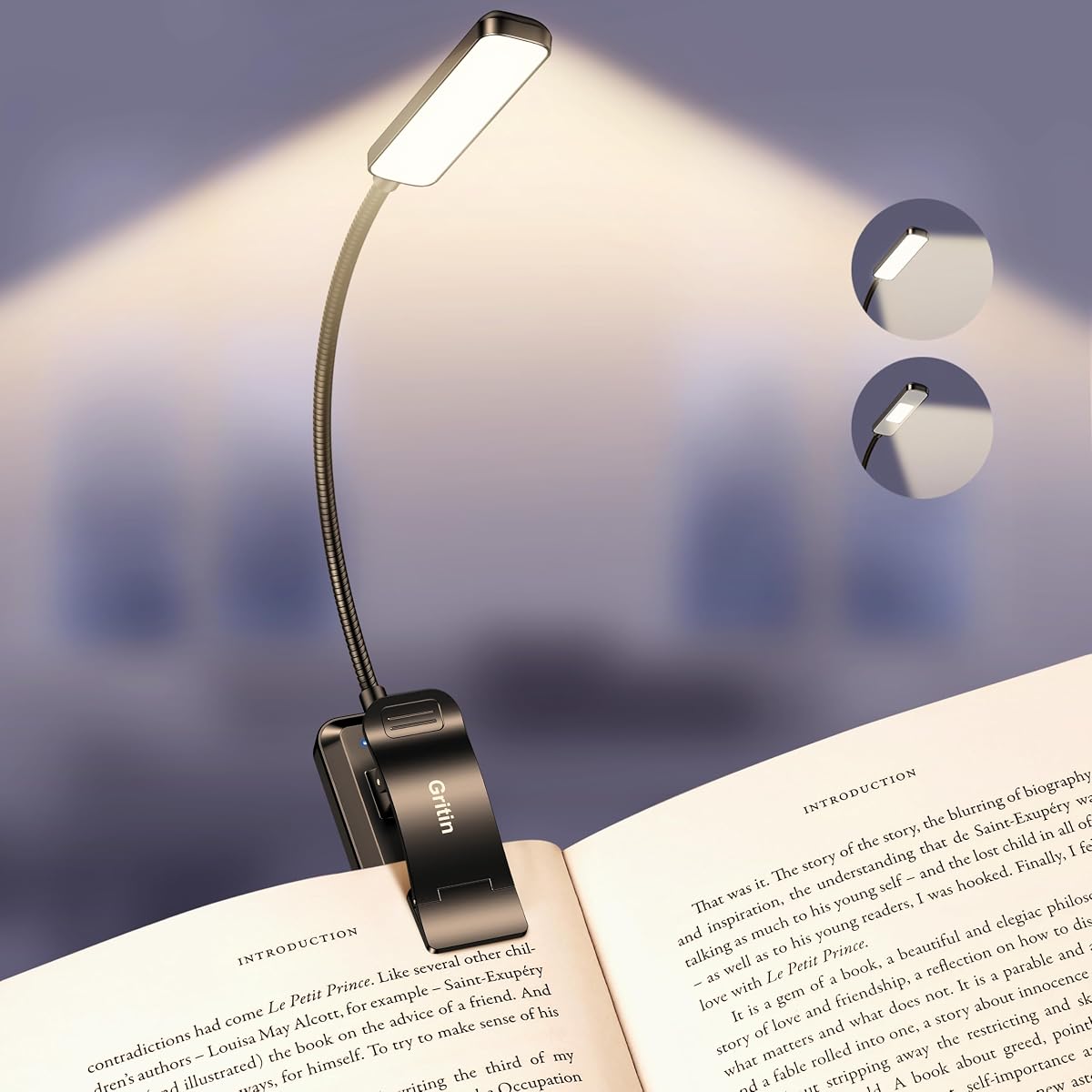 Lampe de lecture noire à pince fixée à un livre ouvert, avec col flexible orienté vers les pages